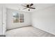 Bedroom featuring a ceiling fan, neutral carpeting and natural light from the window at 521 Cody Ln, Mcdonough, GA 30252