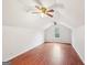 Bonus room features hardwood floors and a ceiling fan at 521 Cody Ln, Mcdonough, GA 30252