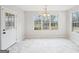 Eat in kitchen featuring lots of natural light and marble floor at 521 Cody Ln, Mcdonough, GA 30252