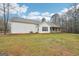 The home's exterior features classic white siding, a covered porch, and an air conditioning unit visible on the side at 521 Cody Ln, Mcdonough, GA 30252
