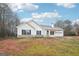 Charming single-story home featuring white siding, black shutters, attached garage, and spacious front yard at 521 Cody Ln, Mcdonough, GA 30252