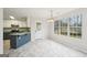 Kitchen featuring modern appliances, a dining area and large windows at 521 Cody Ln, Mcdonough, GA 30252