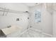Laundry room includes a utility sink and storage shelves for convenience at 521 Cody Ln, Mcdonough, GA 30252