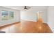 Spacious living room with a large window and hardwood floors at 521 Cody Ln, Mcdonough, GA 30252