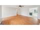 Bright living room featuring hardwood floors and a ceiling fan at 521 Cody Ln, Mcdonough, GA 30252
