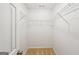 Walk-in closet featuring wire shelving and neutral carpeting at 521 Cody Ln, Mcdonough, GA 30252