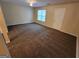 Inviting bedroom with plush carpeting, neutral paint, ample natural light, and ceiling fan at 3535 Waldrop Trl, Decatur, GA 30034