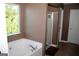 Bathroom featuring a tub, shower, and neutral walls at 4286 Rosehall Ct, South Fulton, GA 30349