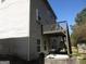 Rear view of the home with a deck and covered patio space at 4286 Rosehall Ct, South Fulton, GA 30349