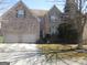 Attractive brick home featuring a two-car garage and neat front yard at 4286 Rosehall Ct, South Fulton, GA 30349