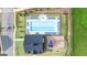 An aerial view of the community pool and playground, highlighting the layout and surrounding green spaces at 1720 Goodwin Dr, Hampton, GA 30228