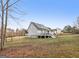 The home's large backyard is fenced-in and features a back deck at 1144 Pickets Ridge Dr, Locust Grove, GA 30248