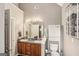 Double vanity bathroom with good storage space and a well-lit mirror at 1144 Pickets Ridge Dr, Locust Grove, GA 30248