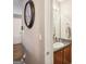Powder room features granite counter tops, neutral paint, and updated fixtures at 1144 Pickets Ridge Dr, Locust Grove, GA 30248