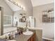 Bathroom with a deep soaking tub, granite counters, and plenty of natural light at 1144 Pickets Ridge Dr, Locust Grove, GA 30248