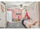 Charming bedroom features a canopy bed, playful decor, and ample natural light at 1144 Pickets Ridge Dr, Locust Grove, GA 30248