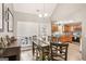 Open-concept layout with a dining area connecting to the kitchen, perfect for entertaining at 1144 Pickets Ridge Dr, Locust Grove, GA 30248