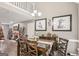 Dining room area with hardwood floors, high ceilings, and stylish decor at 1144 Pickets Ridge Dr, Locust Grove, GA 30248