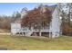 View of the house showcasing the yard and architectural design elements at 1144 Pickets Ridge Dr, Locust Grove, GA 30248