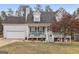 Charming home with a covered front porch, two-car garage, and appealing exterior at 1144 Pickets Ridge Dr, Locust Grove, GA 30248
