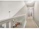 Second story hallway featuring carpet flooring and white painted railing at 1144 Pickets Ridge Dr, Locust Grove, GA 30248