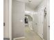 Well-lit hallway with neutral paint, white doors, and access to upper floor game room at 1144 Pickets Ridge Dr, Locust Grove, GA 30248