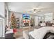 Bright living room with a fireplace, tv, hardwood floors, and festive holiday décor at 1144 Pickets Ridge Dr, Locust Grove, GA 30248