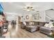 Spacious living room featuring hardwood floors and a comfortable seating arrangement at 1144 Pickets Ridge Dr, Locust Grove, GA 30248