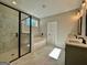 Modern bathroom featuring a glass shower, soaking tub with marble accent wall, and double vanity at 2141 Bradbury Rd # 1, Moreland, GA 30259