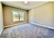 Well-lit bedroom with large window and plush carpeting at 2141 Bradbury Rd # 1, Moreland, GA 30259