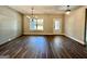 Bright dining area with hardwood floors, ship lap accent wall, modern chandelier, and large window at 2141 Bradbury Rd # 1, Moreland, GA 30259
