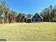 Charming two-story home with a well-manicured front lawn and tree line at 2141 Bradbury Rd # 1, Moreland, GA 30259