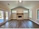 Spacious living room with hardwood floors, brick fireplace, lots of windows and access to patio at 2141 Bradbury Rd # 1, Moreland, GA 30259