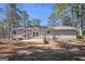 Exterior backyard view of house from deck with sliding glass doors and grill at 4097 Cripple Creek Nw Dr, Kennesaw, GA 30144