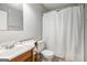 Modest bathroom with shower-tub combo and wooden vanity at 4097 Cripple Creek Nw Dr, Kennesaw, GA 30144