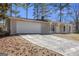 View of a home featuring an attached garage and a covered entryway with decorative support beams at 4097 Cripple Creek Nw Dr, Kennesaw, GA 30144