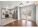 Kitchen with stainless steel appliances, white cabinets, and tile flooring at 4097 Cripple Creek Nw Dr, Kennesaw, GA 30144