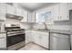 Kitchen with stainless steel appliances, granite countertops, and white subway tile backsplash at 4097 Cripple Creek Nw Dr, Kennesaw, GA 30144