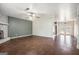 Bright living room with hardwood floors connecting to the kitchen through french doors at 4097 Cripple Creek Nw Dr, Kennesaw, GA 30144