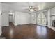 Spacious living room with hardwood floors and a stone fireplace at 4097 Cripple Creek Nw Dr, Kennesaw, GA 30144