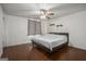 Bedroom with hardwood floors, ceiling fan, and neutral walls at 4097 Cripple Creek Nw Dr, Kennesaw, GA 30144