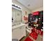 Bright bathroom features a single sink vanity and a Mickey Mouse themed shower at 5509 Park Place South, Atlanta, GA 30349