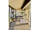 Inviting sunroom with natural light, adorned with cozy seating and decorative floral arrangements at 5509 Park Place South, Atlanta, GA 30349