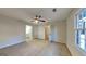 This bedroom has a ceiling fan and neutral carpet at 30 Fairfield Dr, Ellenwood, GA 30294