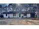 Charming single-story home featuring a cozy front porch and a well-maintained front yard at 30 Fairfield Dr, Ellenwood, GA 30294