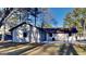 Side view of a one-story home with a garage and manicured lawn at 30 Fairfield Dr, Ellenwood, GA 30294