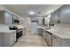 Modern kitchen equipped with stainless steel appliances, stylish gray cabinets, and quartz countertops at 30 Fairfield Dr, Ellenwood, GA 30294