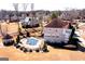 Aerial view of brick home showcasing a luxurious pool area and beautifully landscaped backyard at 1214 Greenridge Ln, Lithonia, GA 30058