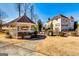 A beautiful backyard featuring a gazebo, iron fence and brick home on a sunny day at 1214 Greenridge Ln, Lithonia, GA 30058