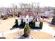 Aerial view of an elegant brick home with lush landscaping and a circular driveway at 1214 Greenridge Ln, Lithonia, GA 30058